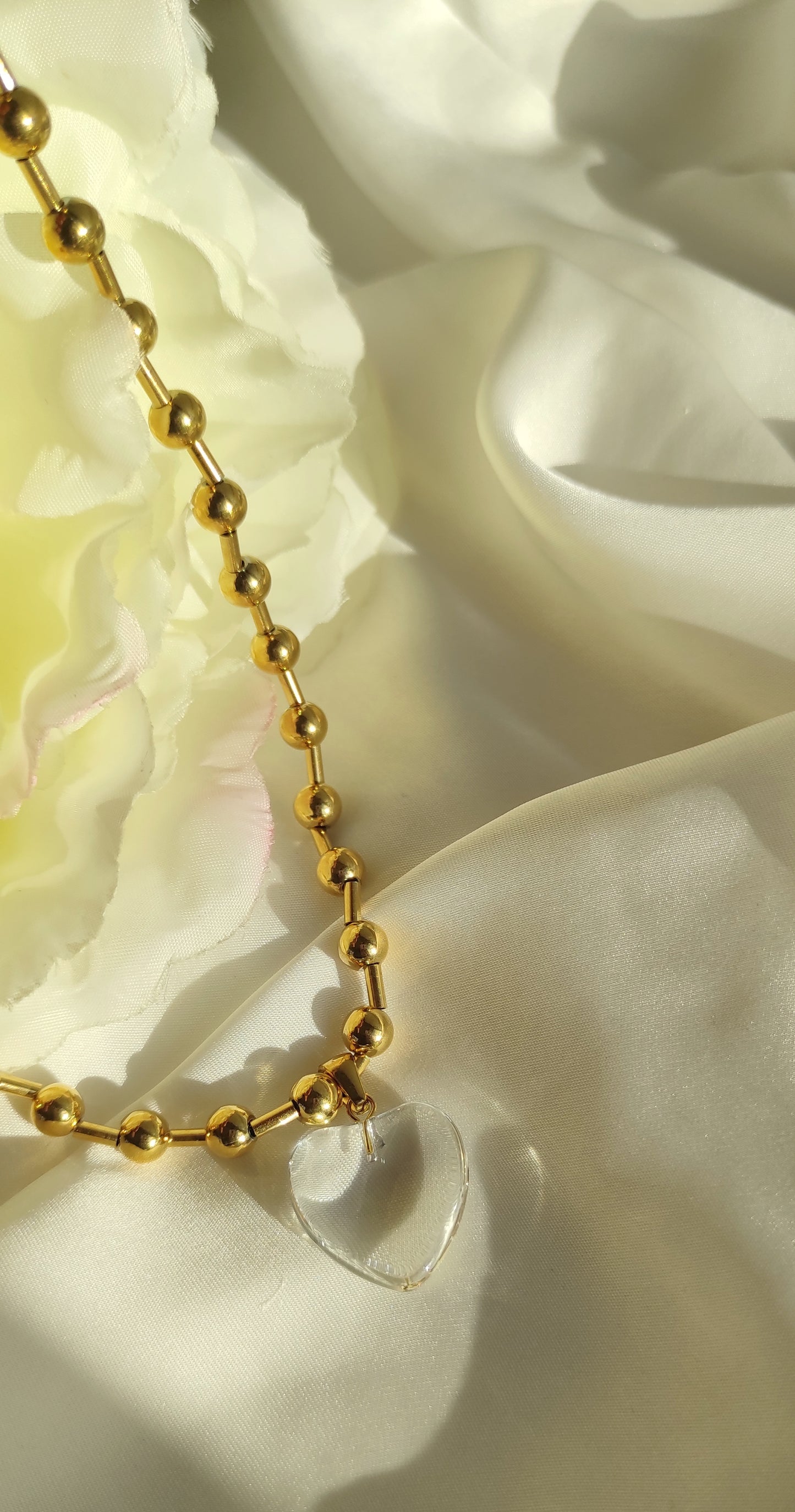 Dulce collar CENTELLA con colgante de corazón transparente