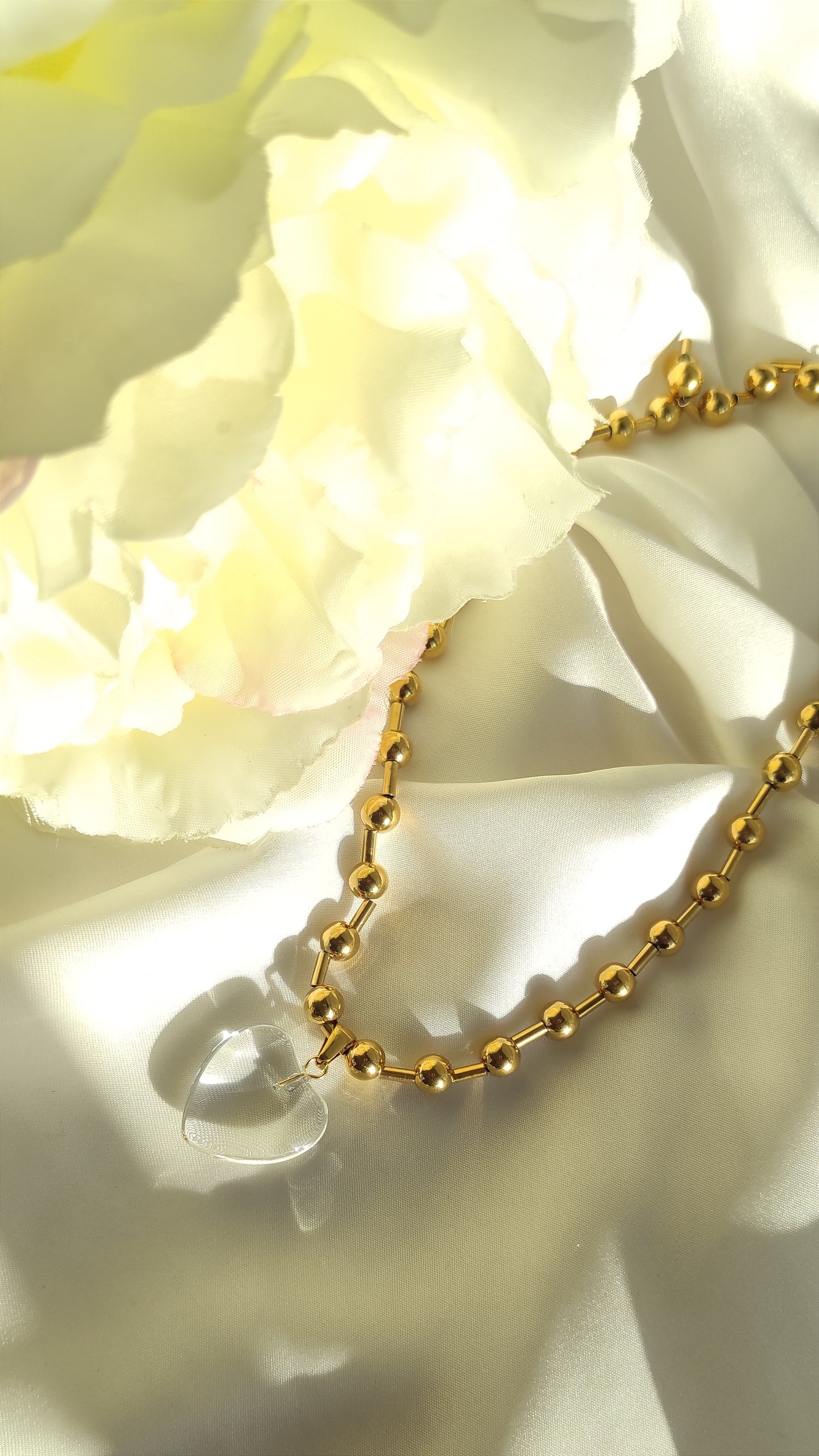 Dulce collar CENTELLA con colgante de corazón transparente